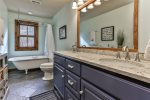 Upper level communal bathroom with clawfoot tub